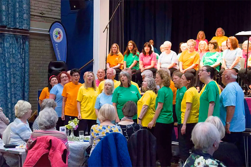 frodsham sings choir on stage indoor performance