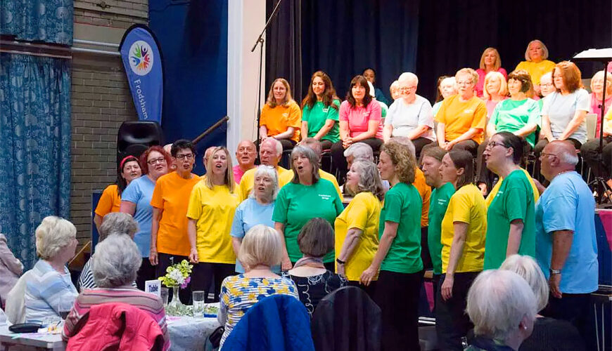 frodsham sings choir on stage indoor performance